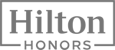 The image displays the Hilton Honors logo in grayscale.