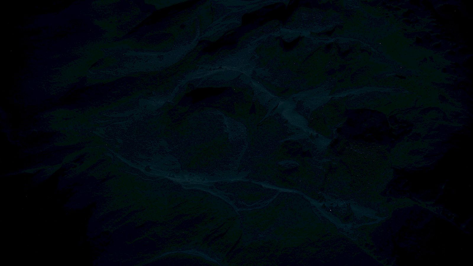 The image is very dark and unclear, making it difficult to identify specific objects or features.