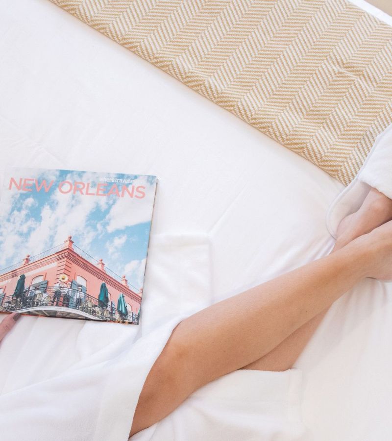 A close-up of a bed with a magazine on it