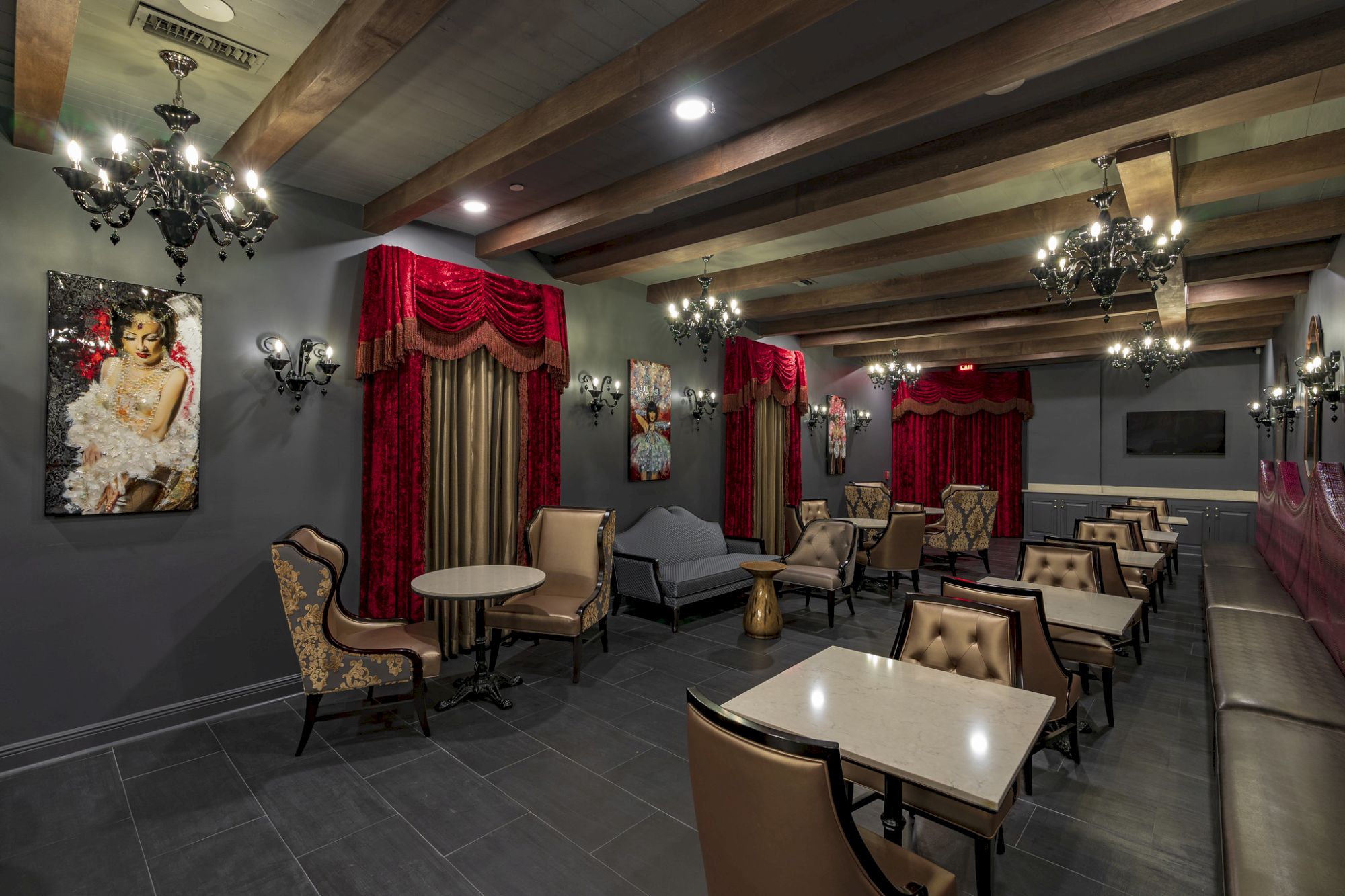 a luxurious lounge with tables and chairs