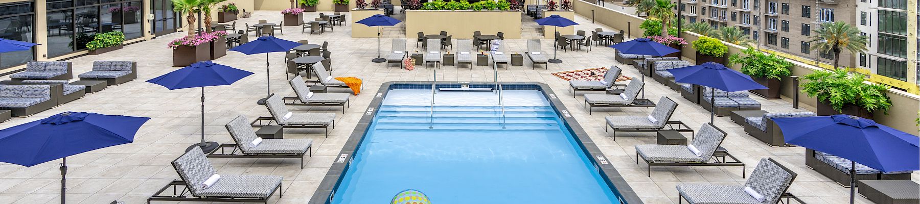 Rooftop pool with lounge chairs at The Jung Hotel & Residences in downtown New Orleans