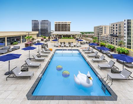 Rooftop pool with lounge chairs at The Jung Hotel & Residences in downtown New Orleans