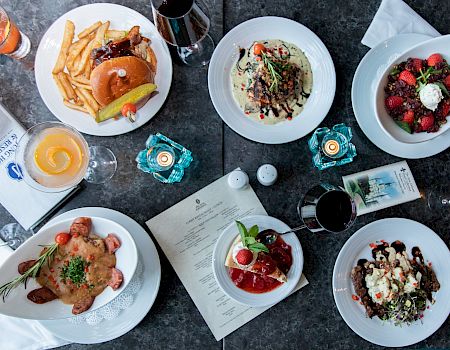 Overhead view of New Orleans dishes served at The Jung Hotel & Residences